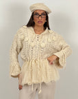Maglia simil lana con fiori in 3D