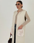 Cardigan lungo con tasche in eco pelliccia
