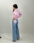 Jeans con tasca brillantinata
