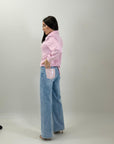 Jeans con tasca brillantinata