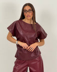 Blusa in ecopelle con trama a rombi