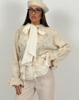 Maglia simil lana con camicia incorporata e fiocco alla gola