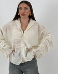 Giacca in organza con dettagli in pizzo