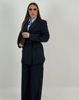 Tailleur 2000 - tailleur gessato con giacca doppio ovetto con cintura nel punto vita e pantalone palazzo