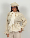 Maglia simil lana con camicia incorporata e fiocco alla gola