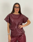 Blusa in ecopelle con trama a rombi