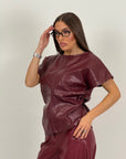 Blusa in ecopelle con trama a rombi